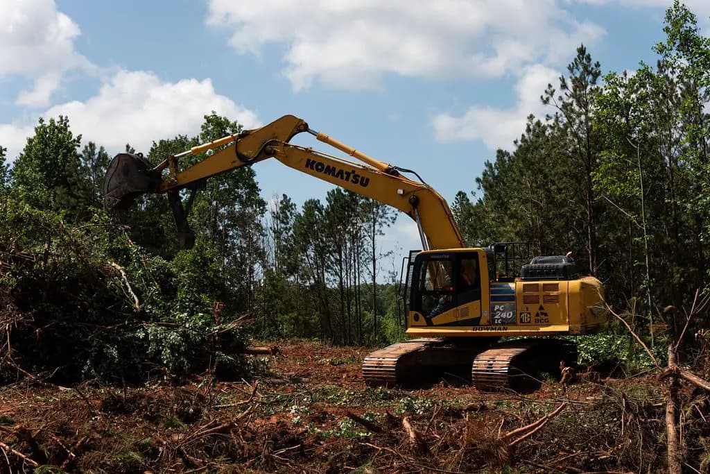 Land clearing equipment removing brush and timber on an Oklahoma property