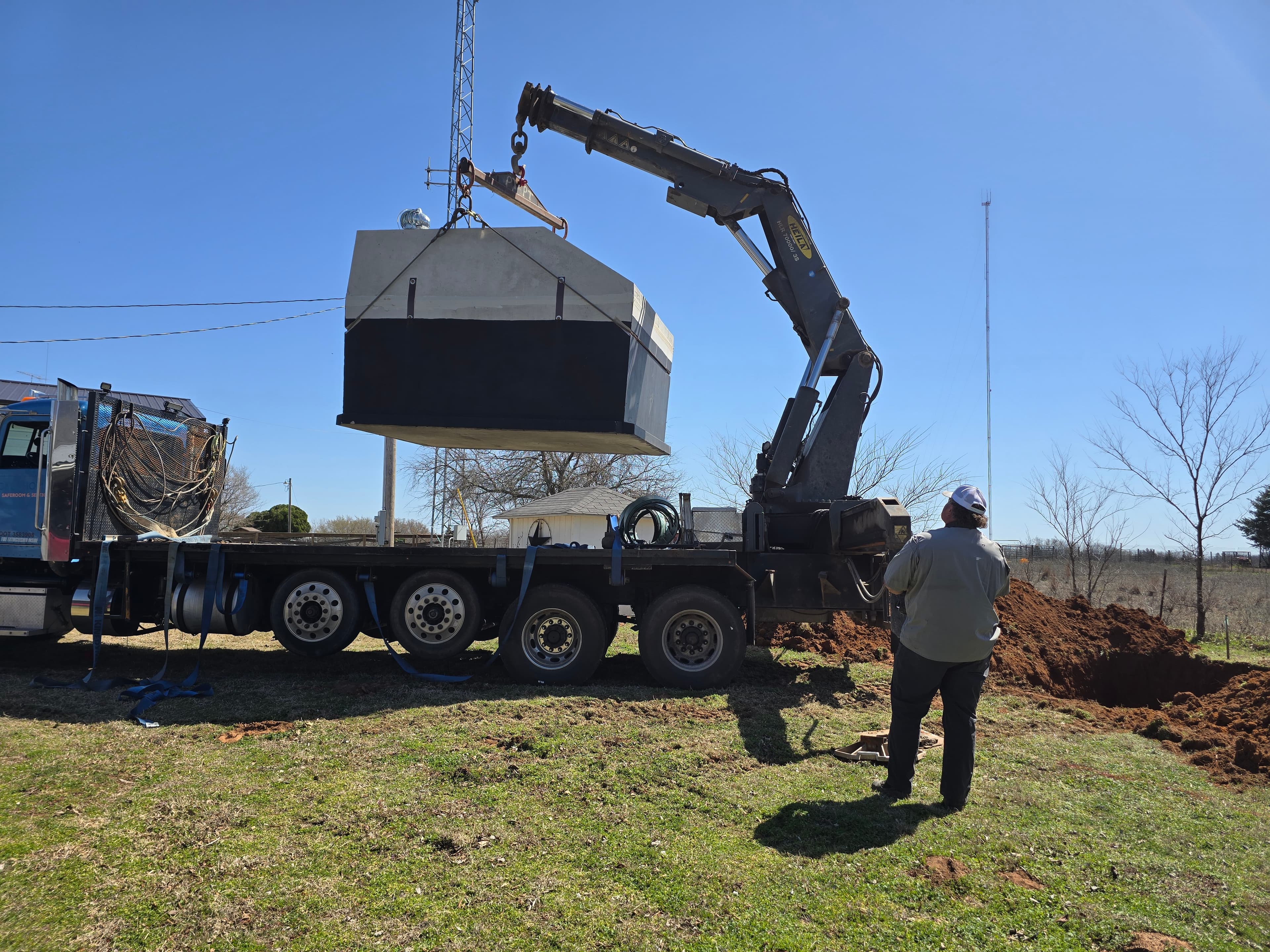 Underground storm shelter being installed